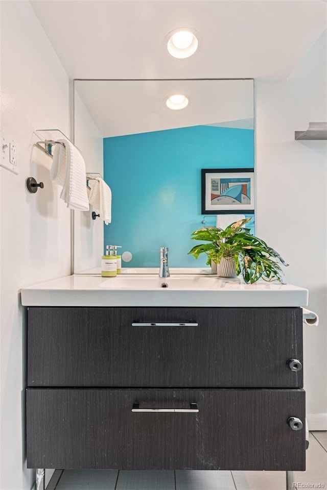 260 S Jasmine St, Denver, CO 80224 - bathroom with tile patterned flooring, recessed lighting, and a sink