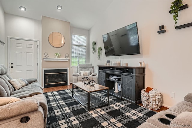 6839 Zenobia St Unit 3, Westminster, CO 80030 - living room with wood finished floors, a glass covered fireplace, baseboards, and recessed lighting