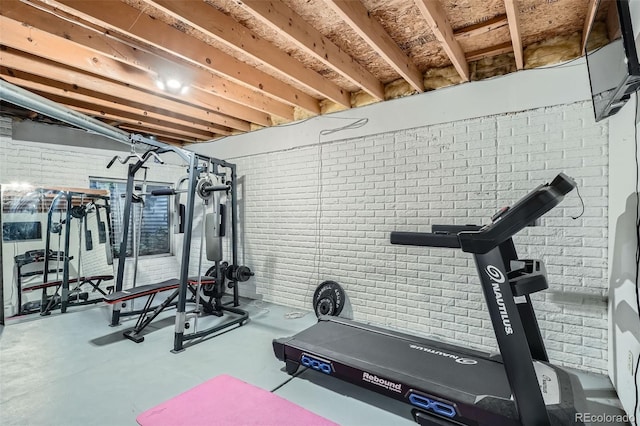 6839 Zenobia St Unit 3, Westminster, CO 80030 - exercise room with brick wall