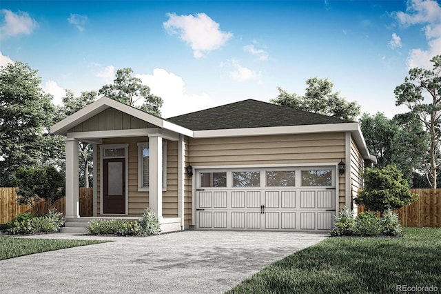 view of front of house featuring an attached garage, fence, and driveway