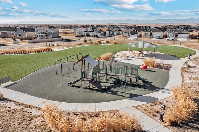 view of community with playground community, a gazebo, a lawn, and a residential view