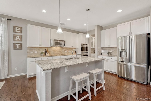 kitchen with stainless steel appliances and white cabinets