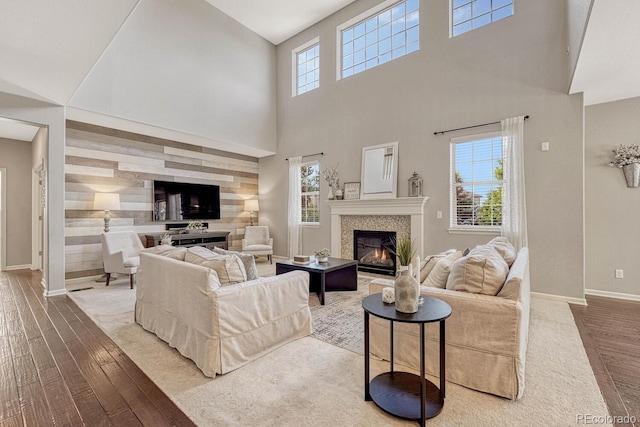 living room featuring hardwood / wood-style floors and a high ceiling