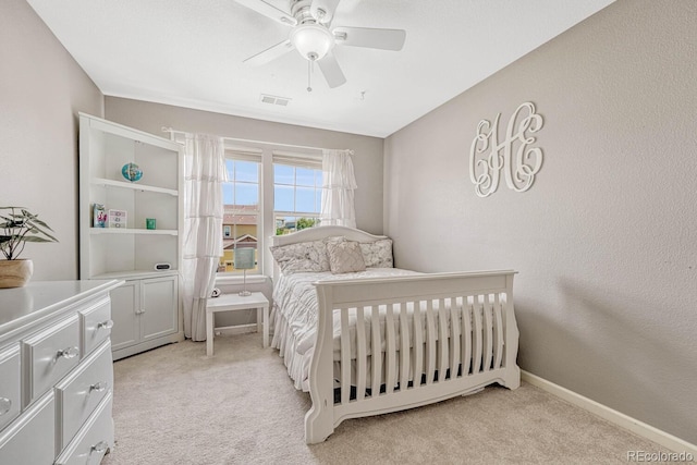 carpeted bedroom featuring ceiling fan