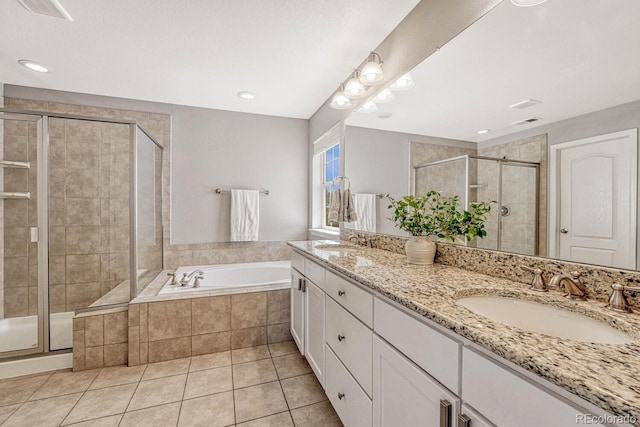 bathroom featuring tile patterned floors, shower with separate bathtub, and vanity