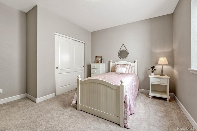 carpeted bedroom featuring a closet