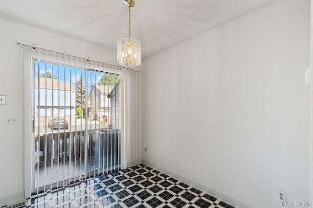 892 Summer Dr Unit 15B, Highlands Ranch, CO 80126 - spare room featuring a chandelier and tile patterned floors