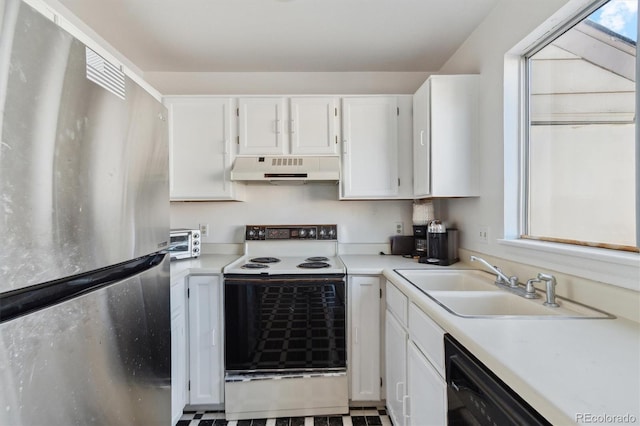 892 Summer Dr Unit 15B, Highlands Ranch, CO 80126 - kitchen featuring freestanding refrigerator, range with electric stovetop, under cabinet range hood, a sink, and white cabinets