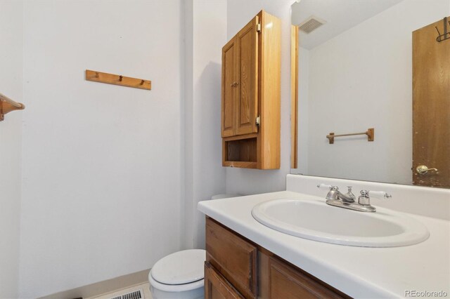 892 Summer Dr Unit 15B, Highlands Ranch, CO 80126 - bathroom featuring toilet and vanity