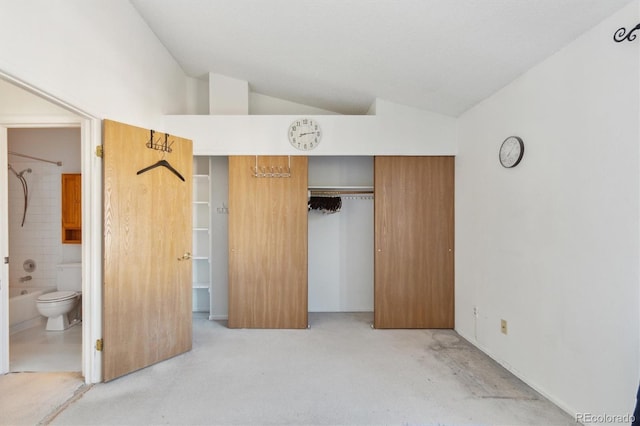 892 Summer Dr Unit 15B, Highlands Ranch, CO 80126 - unfurnished bedroom with vaulted ceiling, a closet, light carpet, and ensuite bathroom