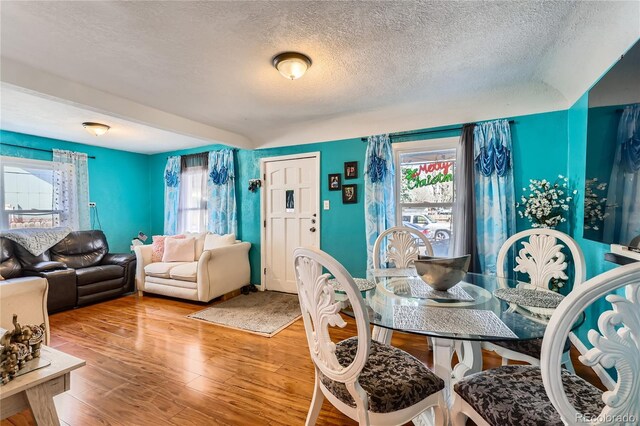 655 S Perry St, Denver, CO 80219 - dining room with wood finished floors and a textured ceiling