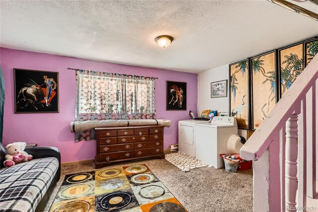 655 S Perry St, Denver, CO 80219 - interior space featuring a textured ceiling, carpet flooring, and washer and clothes dryer