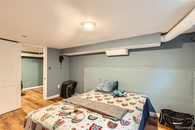 655 S Perry St, Denver, CO 80219 - bedroom featuring light wood-style floors and baseboards