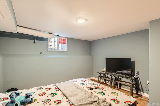 655 S Perry St, Denver, CO 80219 - bedroom featuring baseboards and wood finished floors