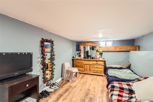 655 S Perry St, Denver, CO 80219 - bedroom with light wood finished floors