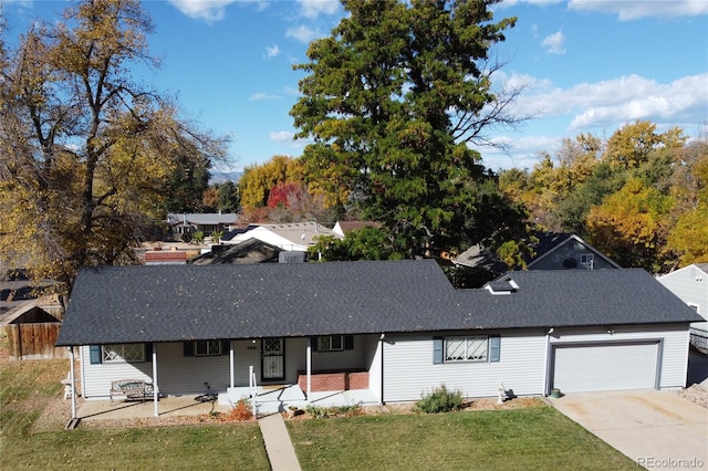 single story home with a garage and a front yard