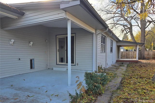 view of property exterior with a patio area