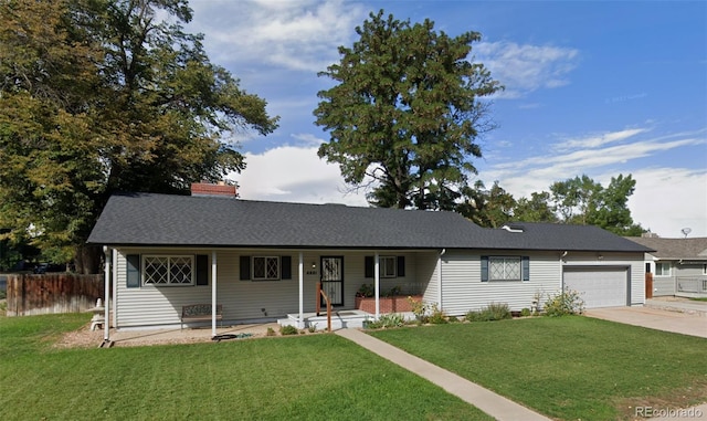 single story home with a front yard and a garage