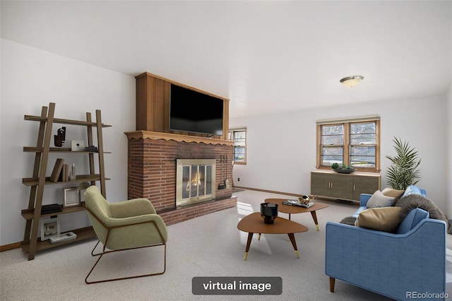 living room featuring a brick fireplace