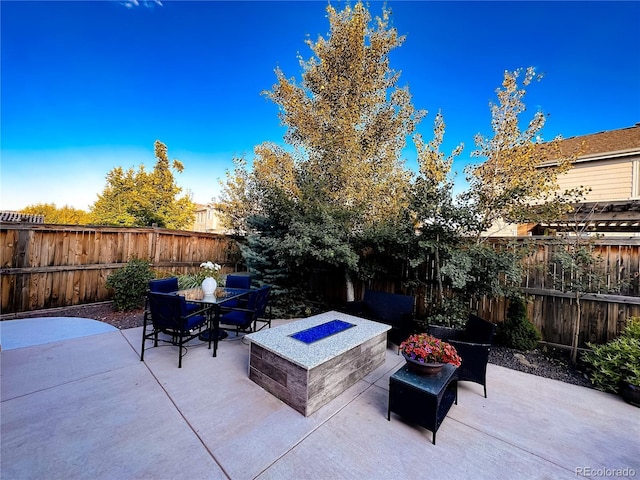 15468 W 50th Pl, Golden, CO 80403 - fenced backyard with a fire pit, a patio, and outdoor dining area