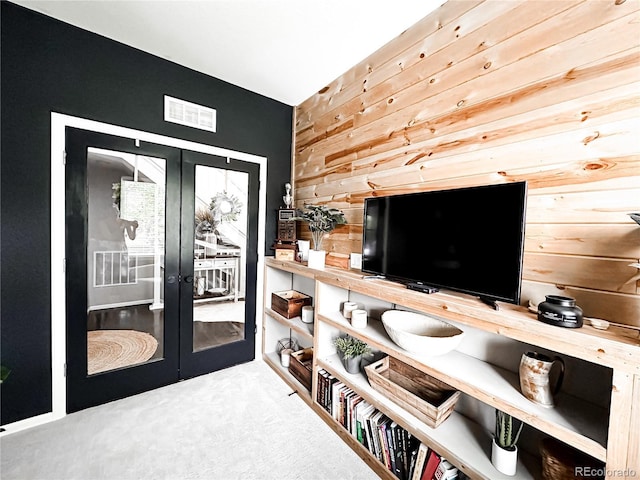 15468 W 50th Pl, Golden, CO 80403 - living area with wood walls, french doors, and carpet floors