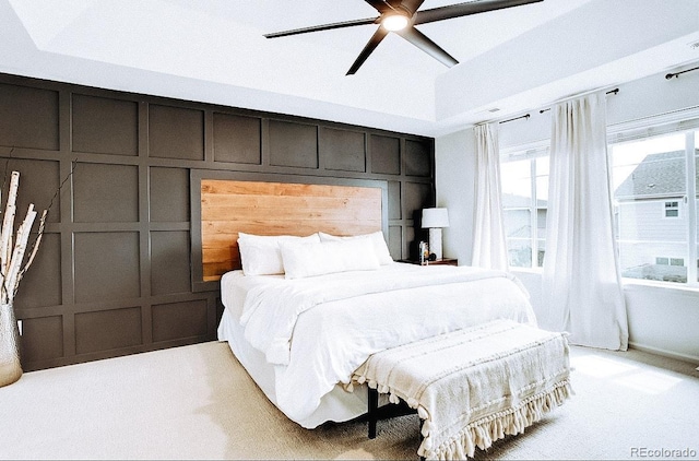 15468 W 50th Pl, Golden, CO 80403 - bedroom featuring a decorative wall, light colored carpet, a ceiling fan, and a high ceiling