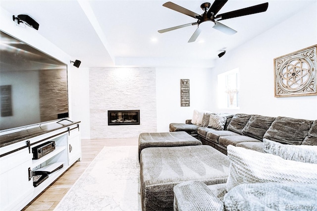 15468 W 50th Pl, Golden, CO 80403 - living area with light wood-style flooring, a ceiling fan, a large fireplace, and recessed lighting