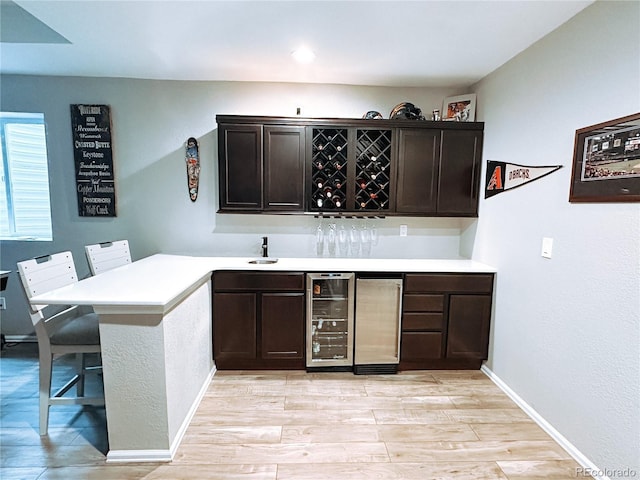 15468 W 50th Pl, Golden, CO 80403 - indoor dry bar with wine cooler and light wood finished floors