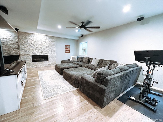 15468 W 50th Pl, Golden, CO 80403 - living area with a ceiling fan, light wood finished floors, a stone fireplace, and recessed lighting