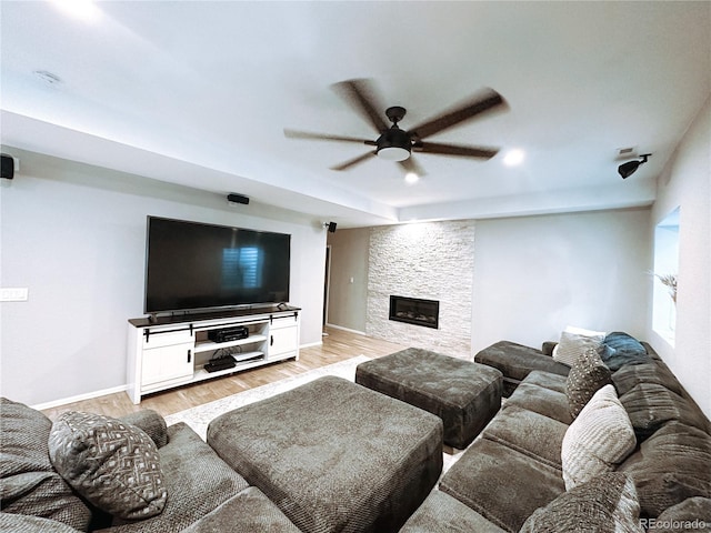 15468 W 50th Pl, Golden, CO 80403 - living room with ceiling fan, light wood finished floors, and a fireplace