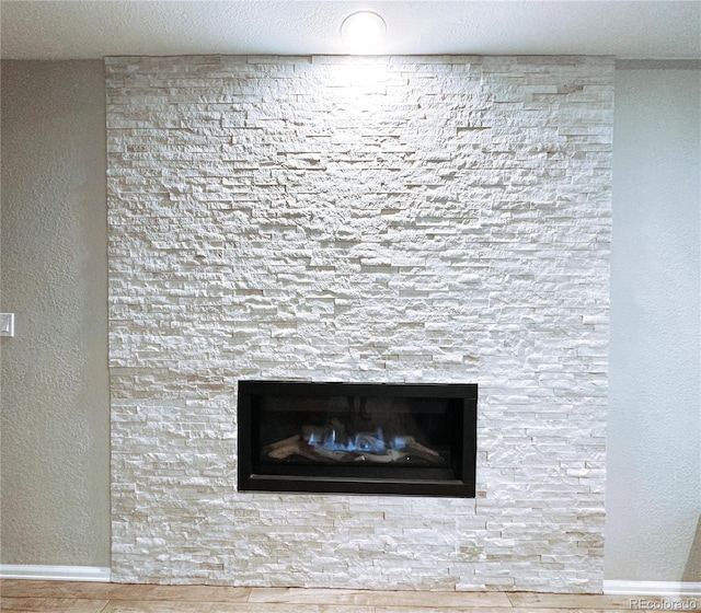 15468 W 50th Pl, Golden, CO 80403 - detailed view of wood finished floors and a fireplace