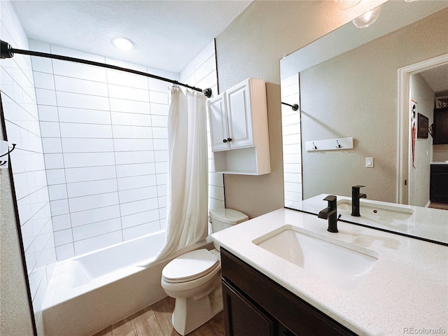 15468 W 50th Pl, Golden, CO 80403 - bathroom with shower / bath combo, vanity, wood finished floors, and a textured wall