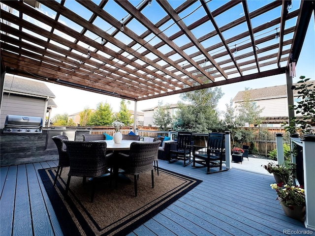 15468 W 50th Pl, Golden, CO 80403 - deck featuring outdoor dining space, an outdoor kitchen, and a pergola