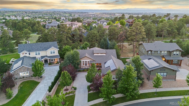 24906 E Geddes Cir, Aurora, CO 80016 - aerial view at dusk of a residential view and a mountain view