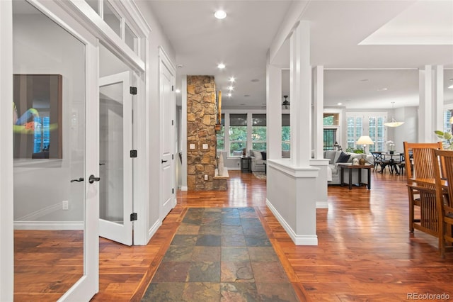 24906 E Geddes Cir, Aurora, CO 80016 - hall featuring decorative columns, recessed lighting, and wood finished floors