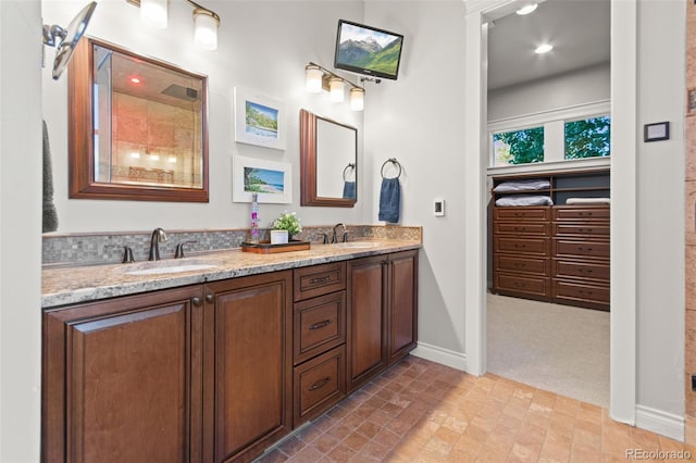 24906 E Geddes Cir, Aurora, CO 80016 - full bathroom featuring double vanity and baseboards