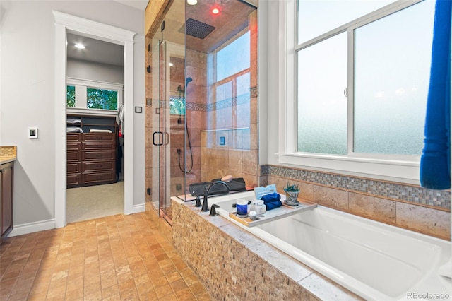 24906 E Geddes Cir, Aurora, CO 80016 - full bath featuring a stall shower, a bath, vanity, brick patterned floors, and recessed lighting