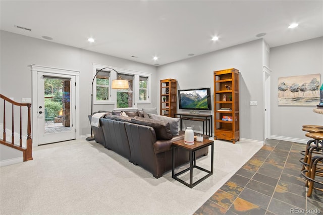 24906 E Geddes Cir, Aurora, CO 80016 - living area with healthy amount of natural light, recessed lighting, stairway, and stone finish floors
