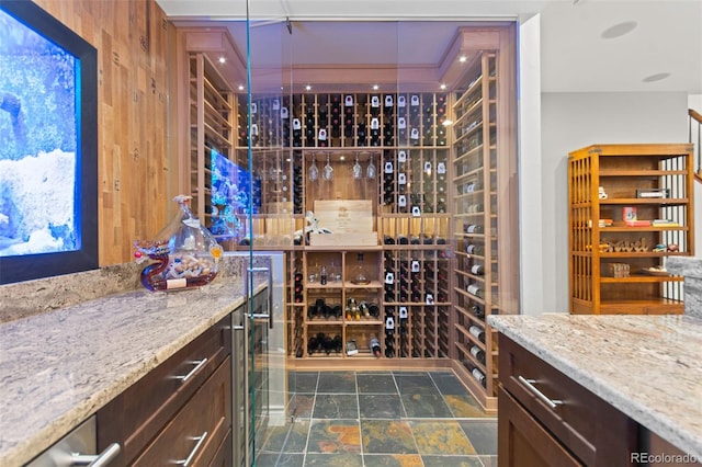 24906 E Geddes Cir, Aurora, CO 80016 - wine room featuring dark stone finish flooring