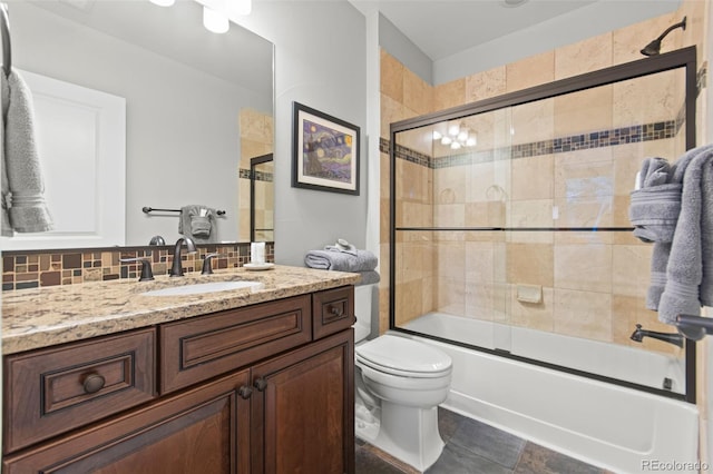 24906 E Geddes Cir, Aurora, CO 80016 - bathroom with vanity, bath / shower combo with glass door, and decorative backsplash