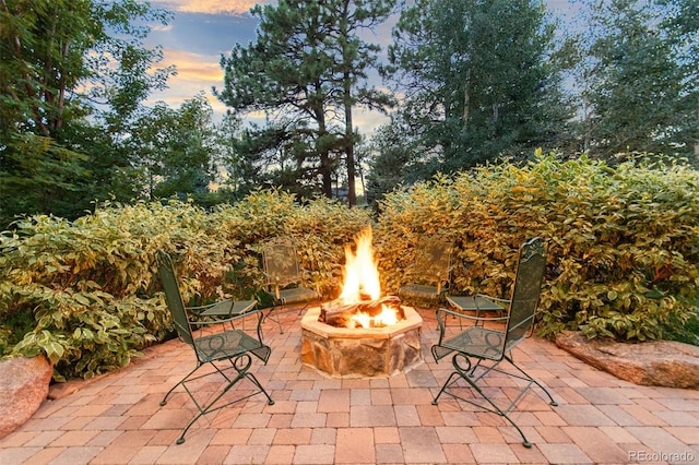24906 E Geddes Cir, Aurora, CO 80016 - patio terrace at dusk with a fire pit and a patio area