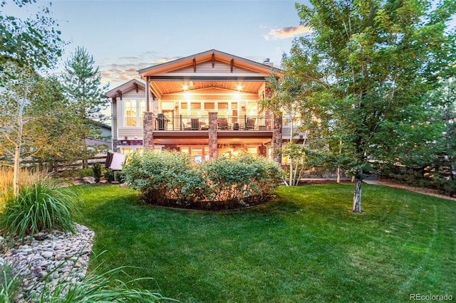 24906 E Geddes Cir, Aurora, CO 80016 - back of property with a yard and a balcony
