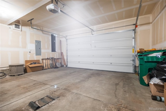 garage with electric panel and a garage door opener