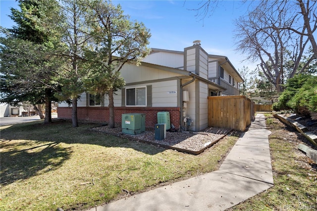 view of home's exterior with a lawn