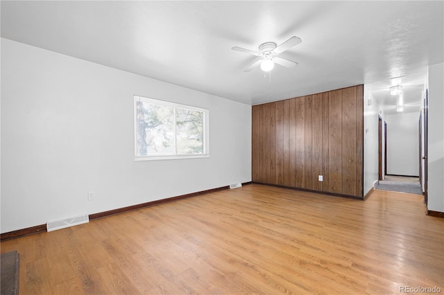 unfurnished room featuring ceiling fan and light hardwood / wood-style floors