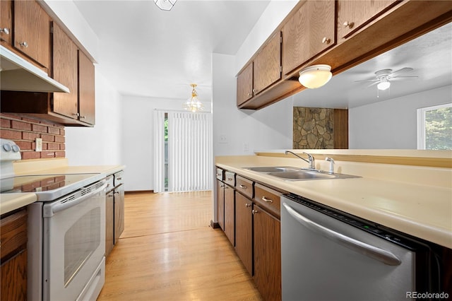 kitchen featuring ceiling fan, sink, stainless steel dishwasher, decorative light fixtures, and electric stove