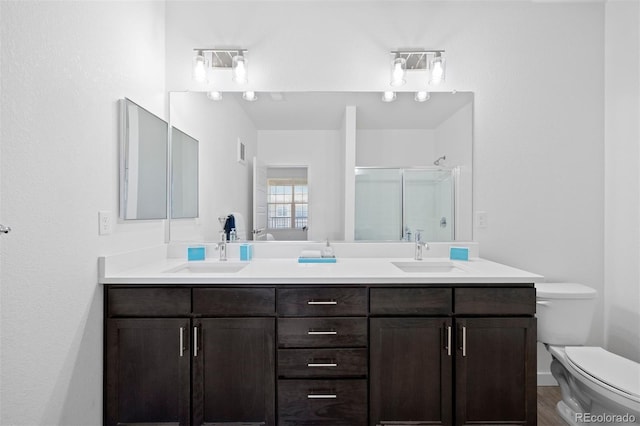 17353 Wilde Ave Unit 308, Parker, CO 80134 - full bathroom with double vanity, a stall shower, and wood finished floors