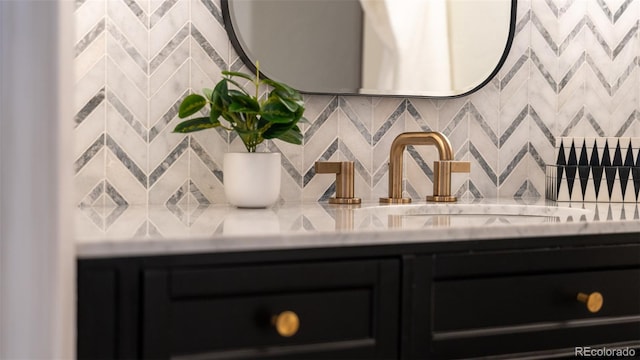 bathroom with backsplash and sink