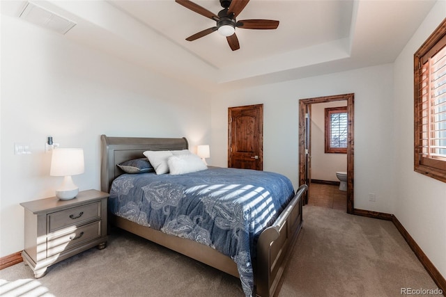 bedroom featuring ceiling fan, carpet, and ensuite bathroom