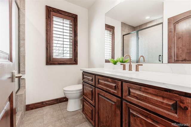 bathroom featuring tile patterned flooring, vanity, an enclosed shower, and toilet